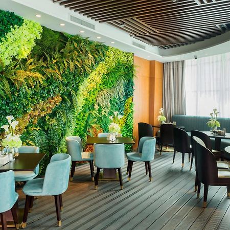 รามาดา พลาซา ฟูเทียน เลค Hotel Chengjiang  ภายนอก รูปภาพ