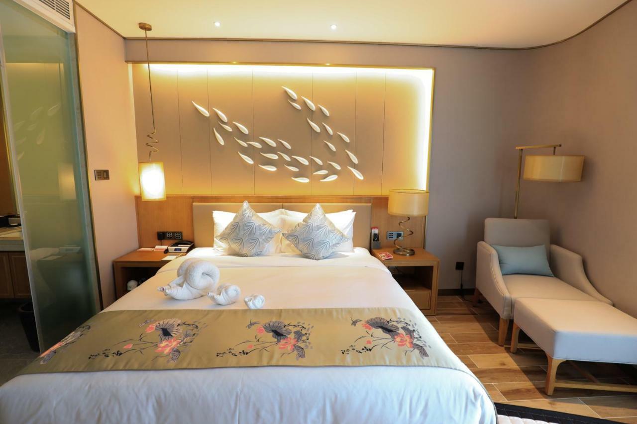 รามาดา พลาซา ฟูเทียน เลค Hotel Chengjiang  ภายนอก รูปภาพ